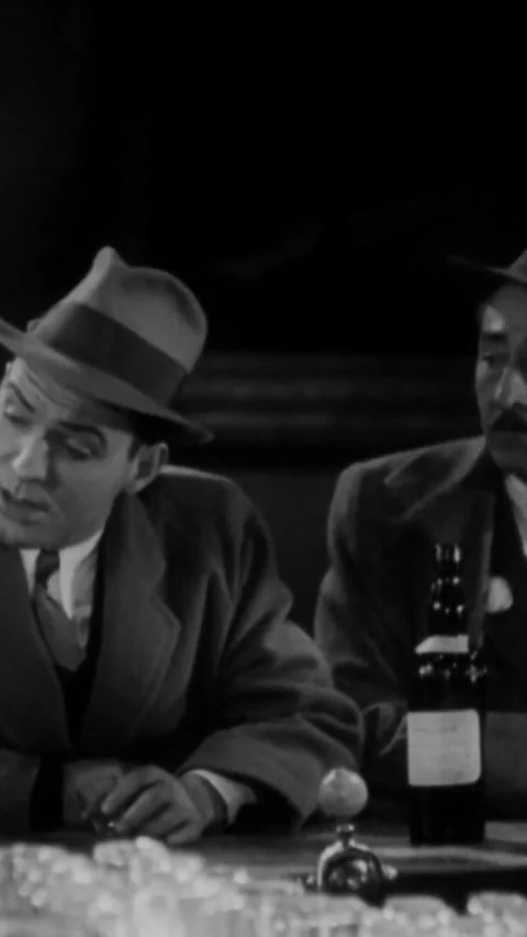 USA - 1931 - In this American pre-code comedy drama film, two men sit around at Video stock 342991330