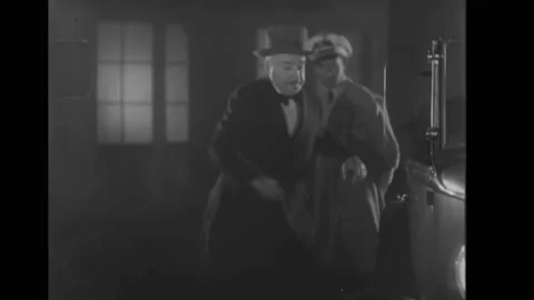 USA - 1931 - In this comedy, a drunk driver trying to leave a driveway keeps Stock Footage 323084182