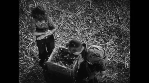 USA - 1931 - In this comedy, kids throw eggs at a farmer to keep him from Stock-Footage 327736239