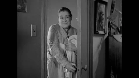 USA - 1931 - In this comedy, a maid interrupts a man in his office and takes a Stock-Footage 325206439