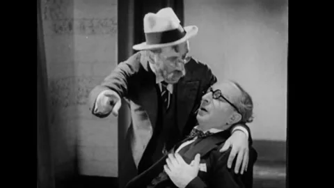 USA - 1931 - In this comedy, a man feigns a heart attack and then talks about an Stock Footage 341980812