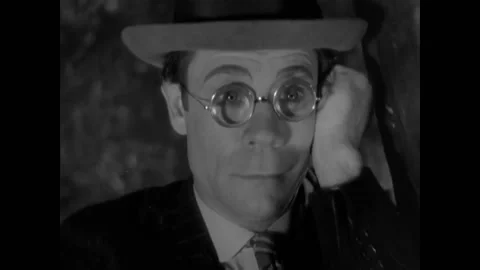 USA - 1931 - In this comedy, a man with round glasses watches people from a tree Stock Footage 325215759