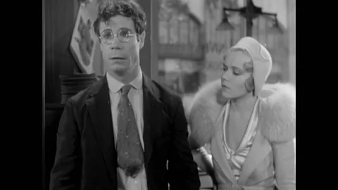 USA - 1931 - In this comedy, a man talks about botany to others. A woman talks Stockbeeldmateriaal 325212737