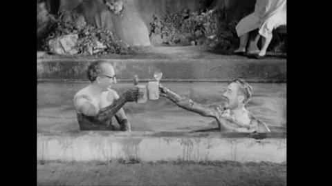 USA - 1931 - In this comedy, men bob up and down drinking from beer steins in a 스톡 동영상 341980802