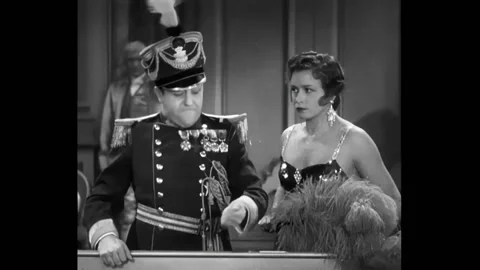 USA - 1931 - In this musical comedy, people stand over a craps table. A soldier Stock Footage 325210000