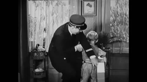 USA - 1932 - In this comedy, a man spanks his son for making a mess at home but Stock Footage 323263385
