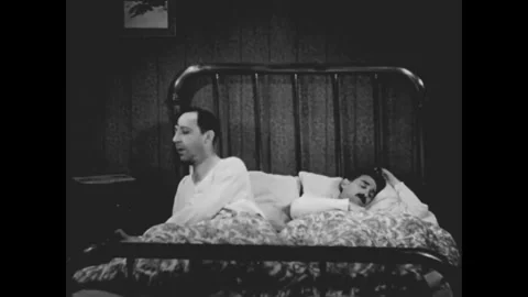 USA - 1932 - In this comedy, the manager of a cab company calls two sleepy Stock Footage 340572948