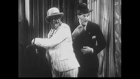 USA - 1932 - In this comedy, two men in a lion cage are laughed at by a crowd. A Stock Footage 341980729
