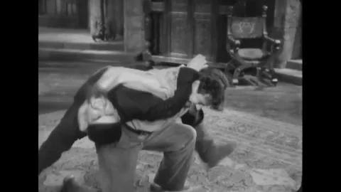 USA - 1932 - In this horror, a man pulls arrows out of a quiver and knocks them Stock Footage 341991638