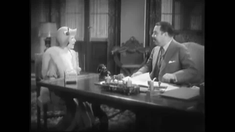 USA - 1932 - In this pre-code drama, a woman meets a man in his office. She asks Stock Footage 327740915