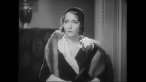 USA - 1932 - In this pre-code drama, a woman meets two men in an elegant office. Stock Footage 327741199