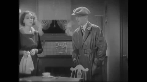 USA - 1932 - In this pre-code drama, a man and woman meet in a kitchen. He takes Stock Footage 327742572