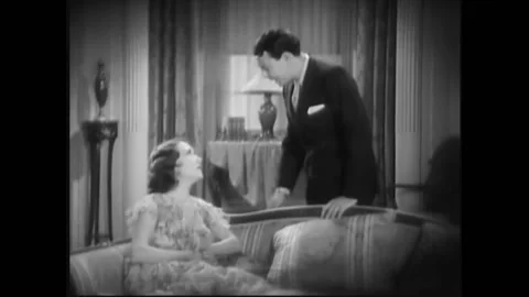 USA - 1932 - In this pre-code drama, man speaks to a woman about confronting a Stock Footage 327744943