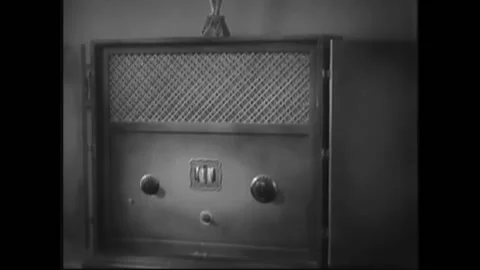 USA - 1932 - In this pre-code drama, a man and woman listen to a radio as a New Stock Footage 327747054