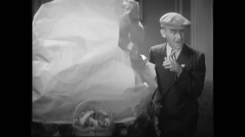 USA - 1932 - In this pre-code drama, a man reveals a large wreath and another Stock Footage 327749127
