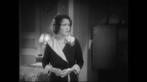 USA - 1932 - In this pre-code drama, man and woman speak in an apartment and the Stock Footage 327755116