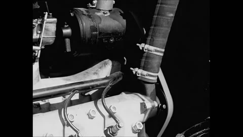 USA - 1933 - A car drives down a road and close-ups of tires and engine parts Stock Footage 327737411