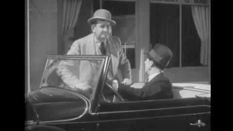 USA - 1934 - In this court comedy, two men speak at a car. Stock Footage 325213698