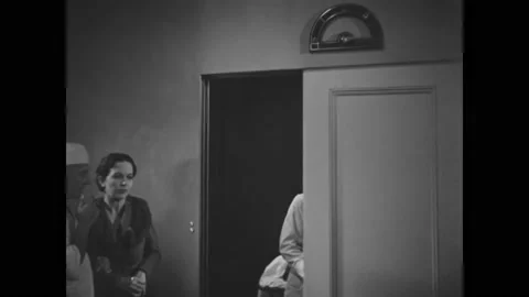USA - 1935 - In this mystery horror, an elevator arrives with a man on a gurney 스톡 동영상 323082854