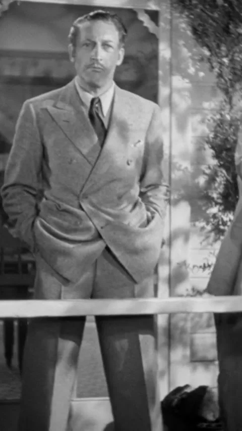 USA - 1936 - in this comedy, an eccentric young man is telling a tall man about Stock Footage 343007623