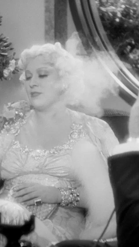 USA - 1936 - in this comedy, a man makes a nice comment while lighting a woman's Stock Footage 343008200