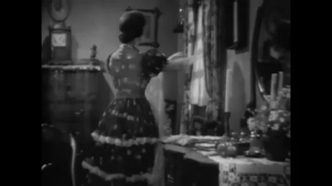 USA - 1939 - In this western, a man knocks on a window and tells a woman not to Stock Footage 341979507