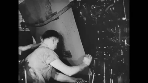 USA - 1940 - A photo offset press room is shown. Then clamp photo plates on a Stock Footage 327737424