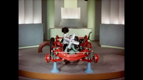 USA - 1940 - Stop-motion animation depicts tires being added to a Chrysler Stock Footage 341326905