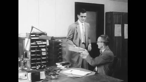 USA - 1940s - A man gets a high score on a test to become a postal Stock Footage 264660196