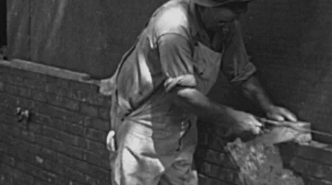 USA - 1941: bricklayer builds a wall Video stock 48725274
