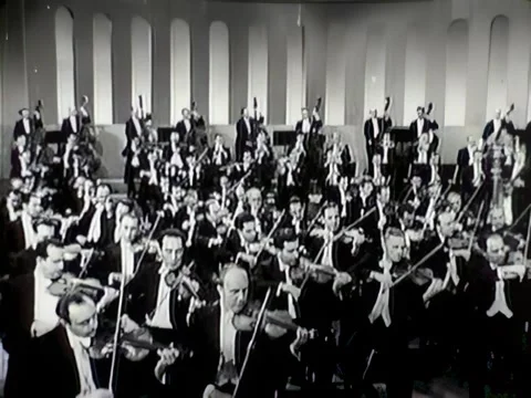 USA - 1943 - Brass and strings are used as a symphony orchestra begins an Stock Footage 331099223