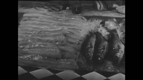 USA - 1946 - Halibut, white fish, and frozen cod fillets are sold at a fish Stock Footage 259549874
