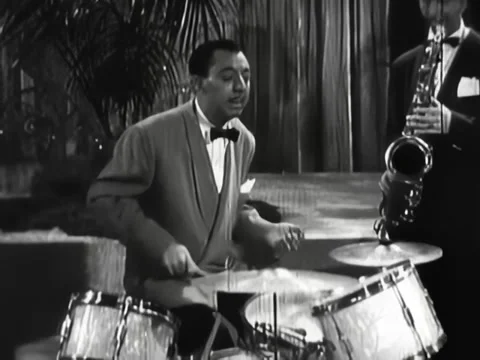 USA - 1946 - Ray Bauduc concludes a jam session with a drum solo, and a porter Stock Footage 331099238