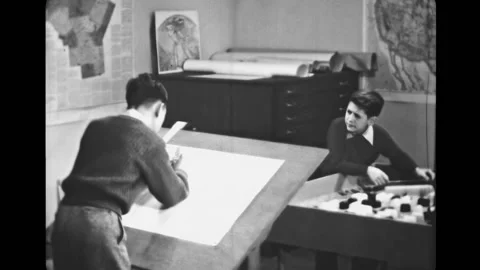 USA - 1946 - Two boys draw a map from a scale model on a drafting table. Boy Stock Footage 327737533