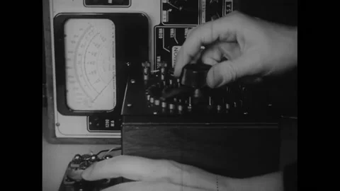 USA - 1948 - A man turns up an electrical device to shock rats in a cage. A Stock Footage 327753630