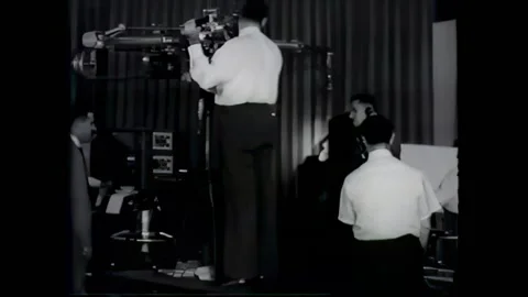 USA - 1950 - An orchestra plays in a pit. Television equipment is used in a Stock Footage 327742468