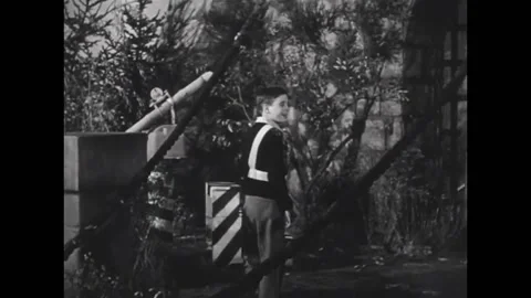 USA - 1950 - A young boy with a sash speaks with a crossing guard. They speak Stock Footage 327745431