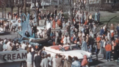 USA - 1950s: 50s car pulls a gondola shaped float during a street parade Stock Footage 258215702
