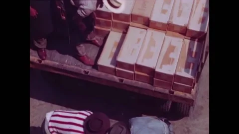 USA 1950s - Men finish loading boxes of US Navy ammunition onto a truck. 스톡 동영상 261573446