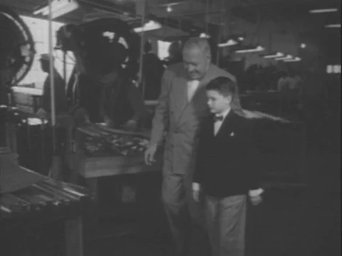 USA - 1950s - Oranges are squeezed by machine, packaged, and sent out for Stock Footage 82908138