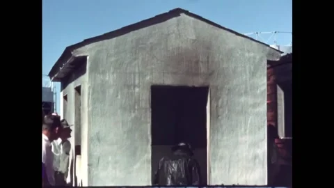 USA - 1950s - People examine three structures made of different materials in a Stock Footage 327736615