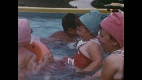 USA - 1950s: Сhildren into the pool Video stock 153607449