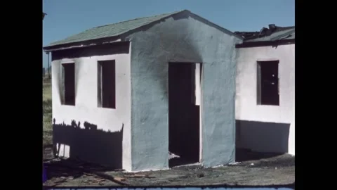 USA - 1950s - Three structures are shown after the results of a fire test and Stock Footage 327754045
