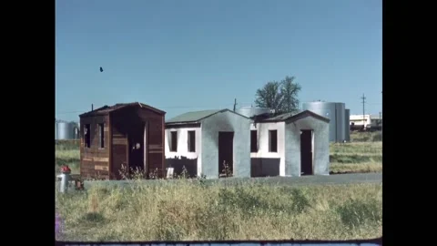 USA - 1950s - Three structures made of different materials are examined after a Stock Footage 327739208