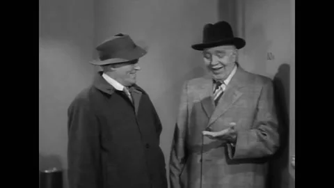 USA - 1952 - In this comedy, two men speak in a hallway and an older woman Stock-Footage 327743794