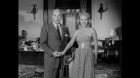 USA - 1952 - A model asks an actor how 3-D movies work. Stock Footage 341327143