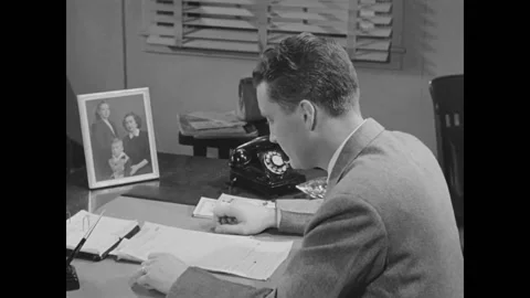 USA - 1952 - Self-employed workers fill out special income tax forms for their Stock Footage 308178840