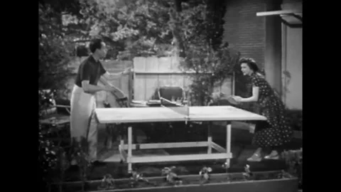 USA - 1953 - In this comedy, a man and woman play ping pong. The woman picks up Stock Footage 341991090