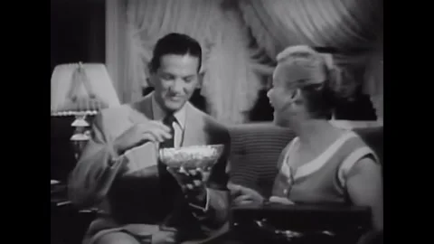 USA - 1953 - In this comedy, a man eats popcorn and a girl dances to jazz on a Stock Footage 341991783