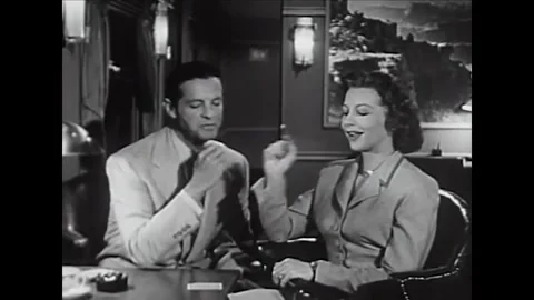 USA - 1953 - In this comedy, a man shuffles cards, doing a magic trick for a Stock Footage 341991832